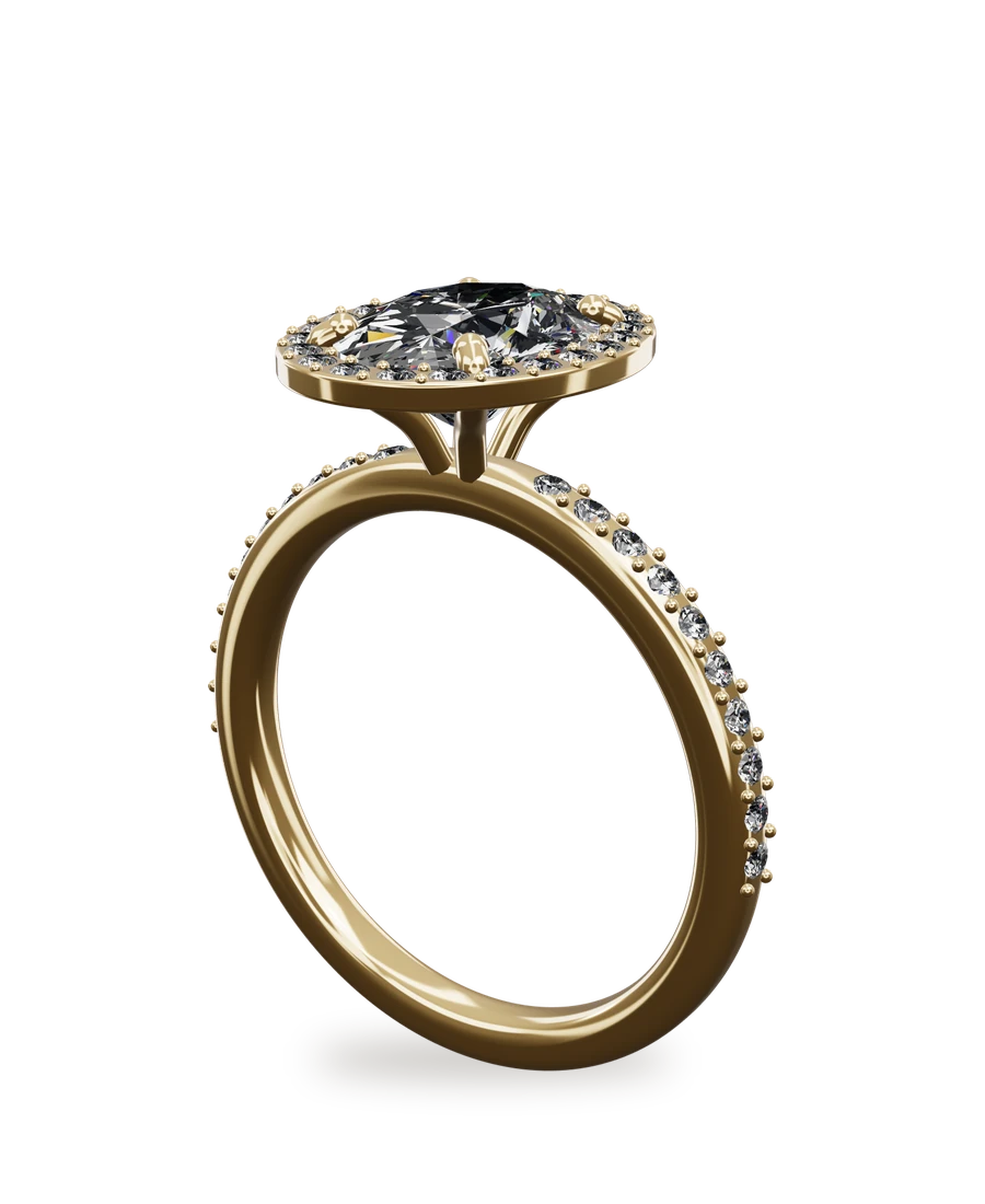 An oval diamond engagement ring with a diamond halo in yellow gold, designed in the Hand & Vow designer