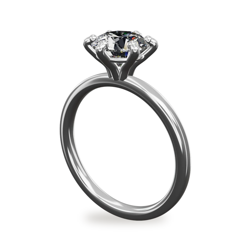 A round diamond solitaire engagement ring with six prongs in platinum